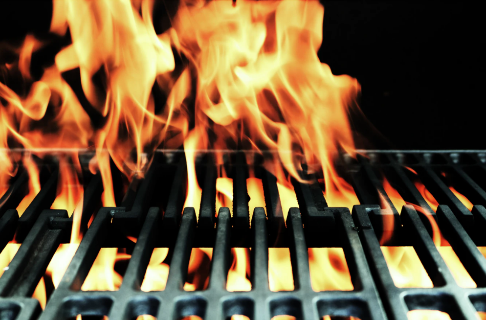Photo of Fire Seeping Through Grill Grates 